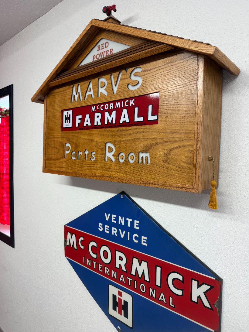 Hand-built wooden Marv's McCormick Farmall Parts Room sign